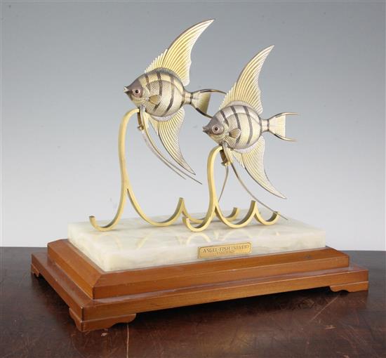 Takehiko. A pair of silver Angel Fish on gilt metal stylised waves, 9.25in.